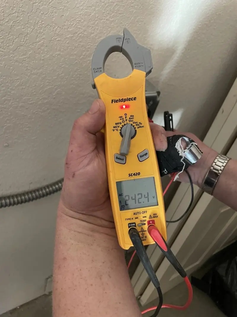 Voltage testing with clamp meter during Generator Installation in Thousand Palms